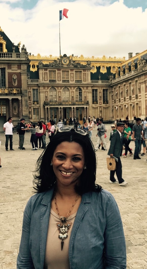 Teacher standing at the Palace of Versailles